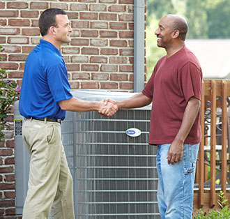 Carrier dealer handshakes with a customer