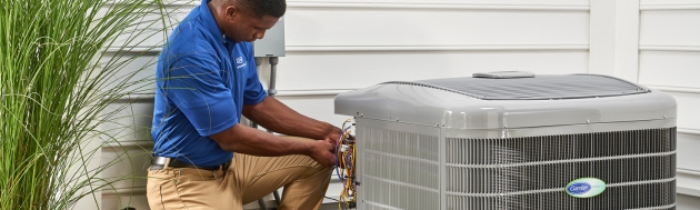 AC Maintenance and Tune-up services: carrier technician working on unit