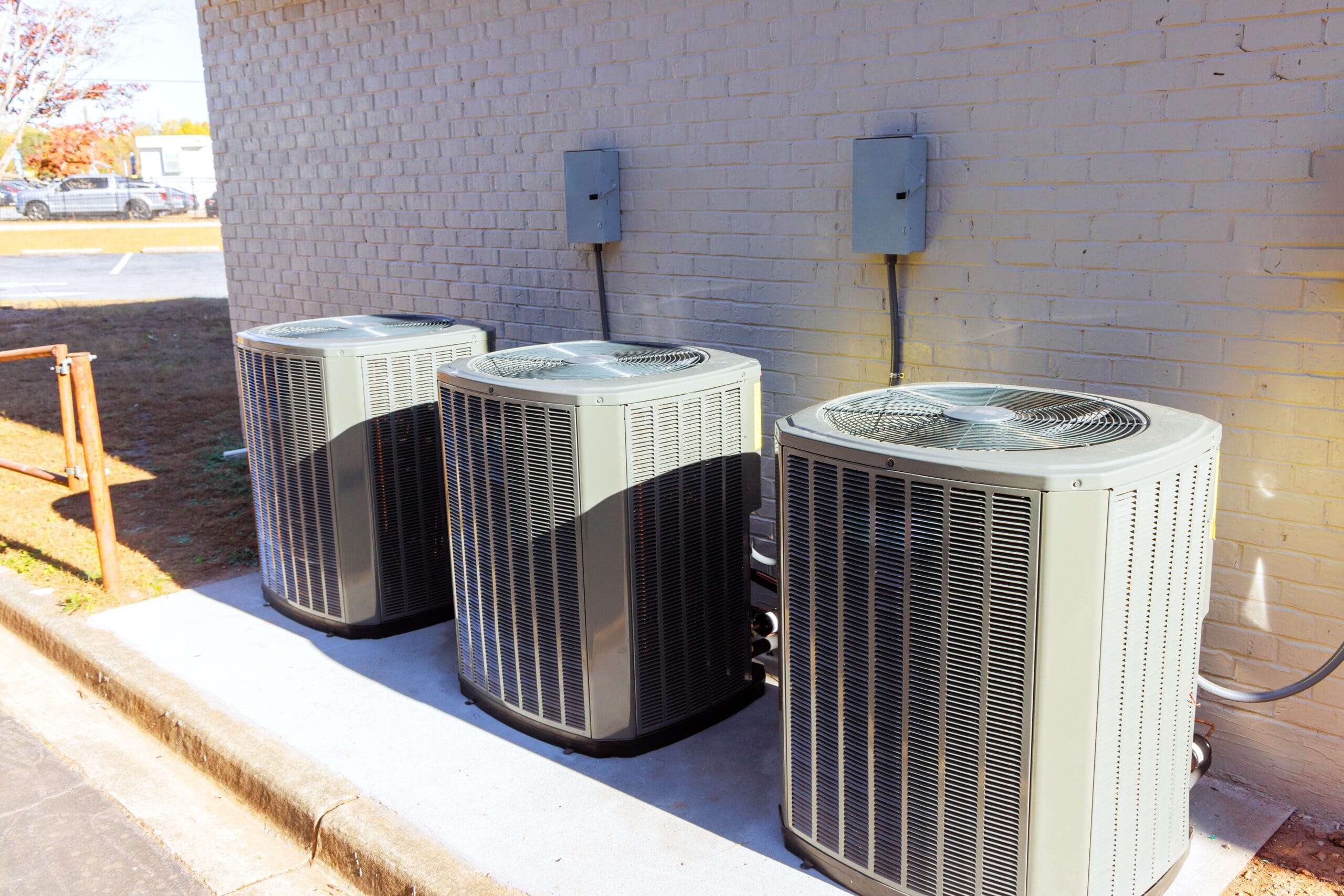 An outdoor air conditioning unit installed on a building's exterior, showcasing its modern design and functionality.